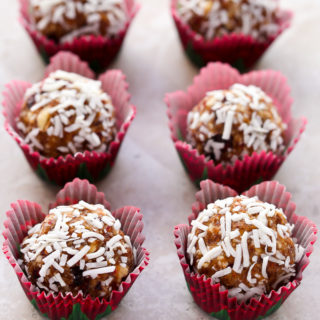 Overhead view of Cranberry Coconut Energy Balls on a neutral background.