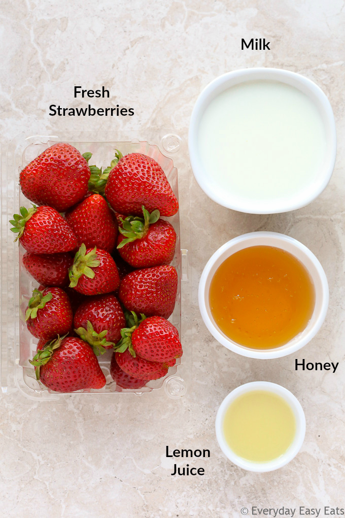 Overhead view of ingredients used to make Creamy Strawberry Milk Popsicles.