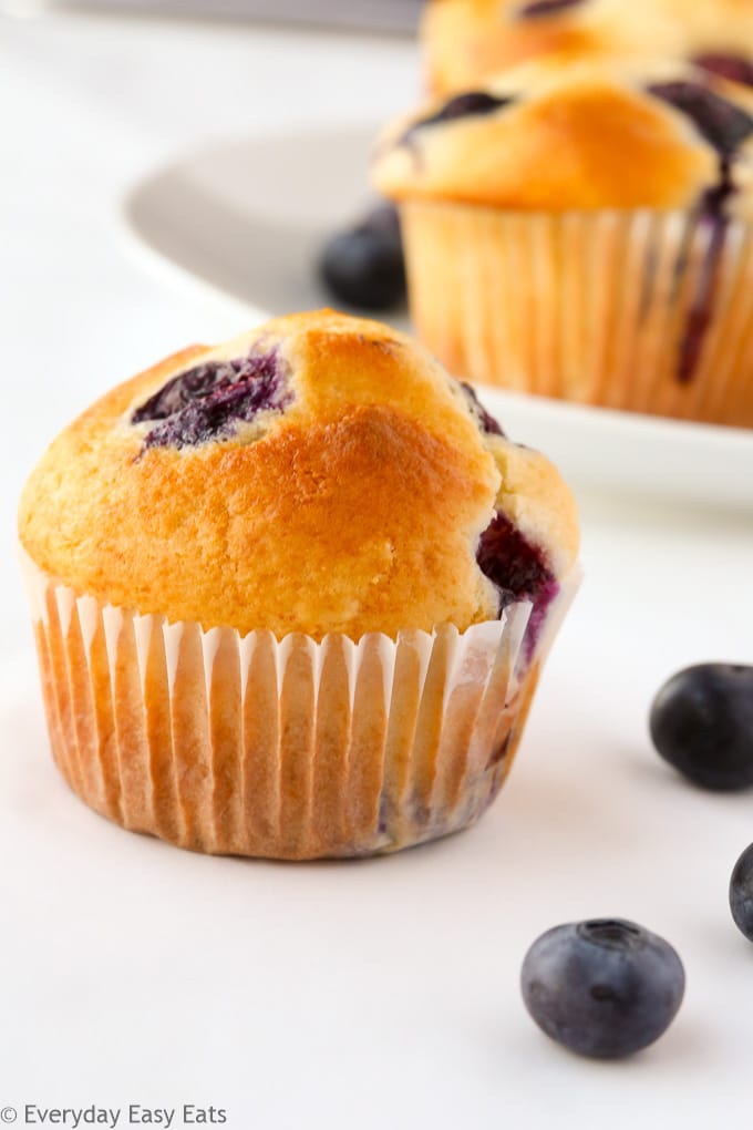 Side view of freshly baked blueberry muffins