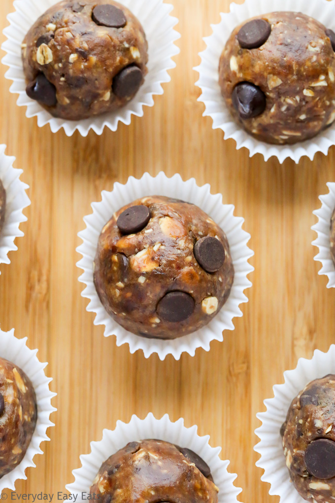 Close-up overhead view of Peanut Butter Date Balls on a wooden background.