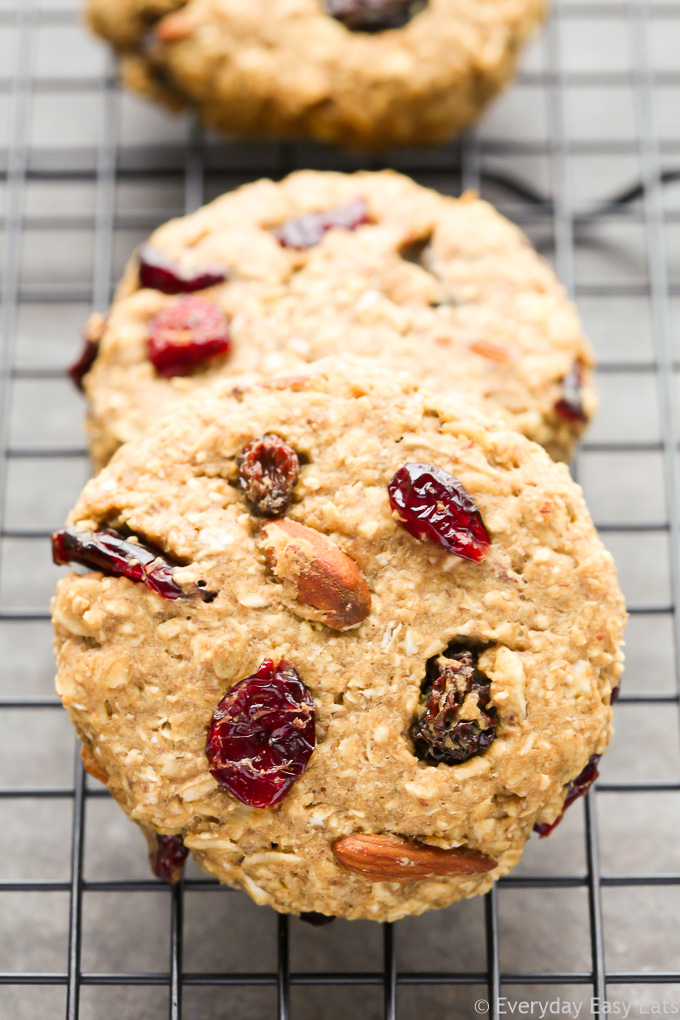 Side view of Peanut Butter Banana Oatmeal Cookies on a wire cooling rack set on a dark background.