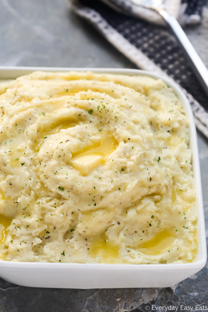 Close-up overhead view of Goat Cheese Mashed Potatoes on a grey background.