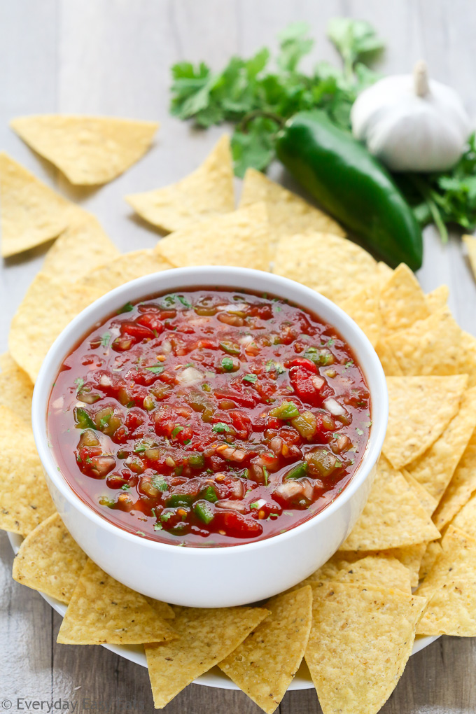 Side view of Restaurant-Style Salsa in a white bowl with chips all around.