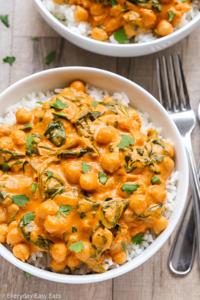 Close-up overhead view of Indian Coconut Chickpea Curry with rice in a white bowl