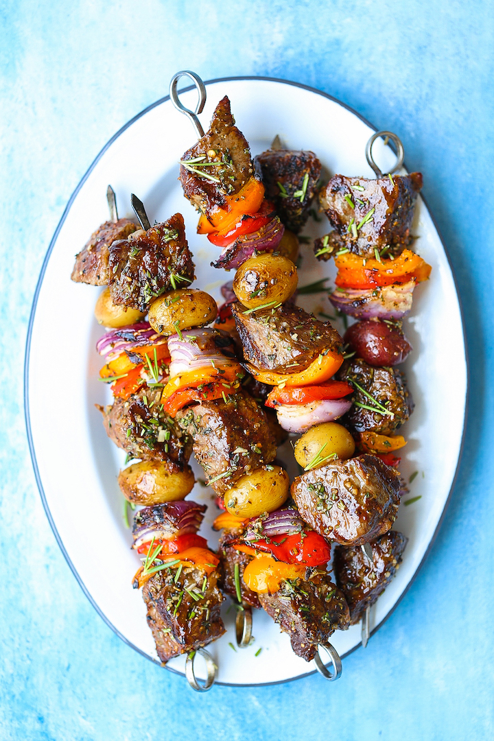 Healthy Grilled Meat Recipes for Summer: Overhead view of Steak and Potato Kabobs in a white plate.