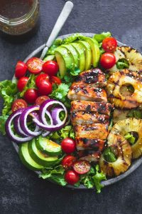 Healthy Grilled Meat Recipes for Summer: Overhead view of Grilled Teriyaki Chicken Salad in a serving bowl.