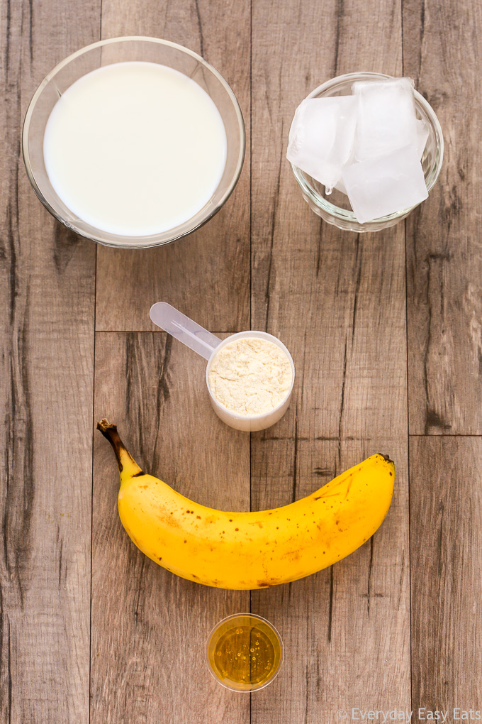 Overhead view of Whey Protein Shake ingredients on a wooden background.