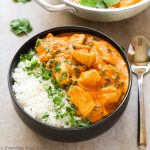 Overhead view of Indian Coconut Chicken Curry in a bowl with title text overlay.