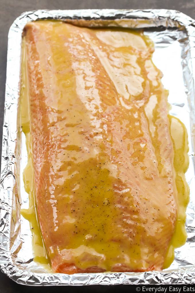 Overhead view of Honey Mustard Salmon on a foil-lined baking sheet before going into the oven.