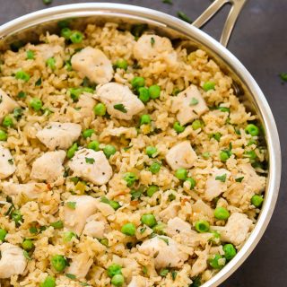 Overhead view of One-Pot Chicken and Rice in a silver skillet.