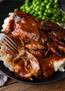 Close-up side view of Slow Cooked Lamb Shanks in Red Wine Sauce