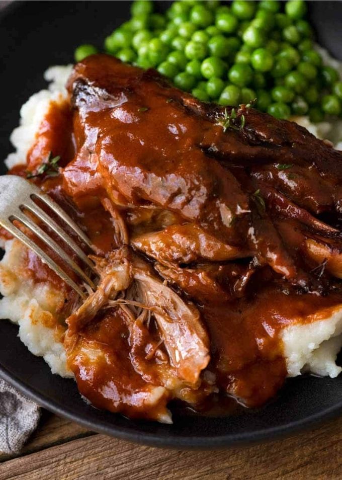 Healthy Meat Recipes: Close-up side view of Slow Cooked Lamb Shanks in Red Wine Sauce