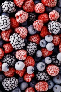 Close-up overhead view of frozen mixed berries.